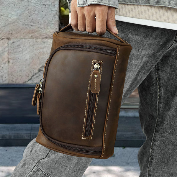 Man holding a retro cowhide bag